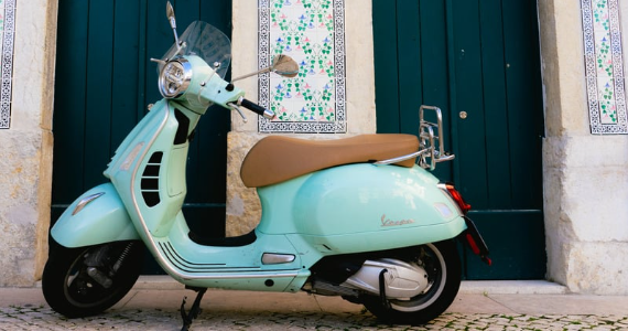 Essential Lisbon vespa with traditional tiles