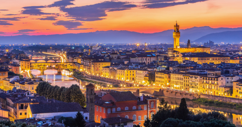 The city of florence lies under the beautiful sunset