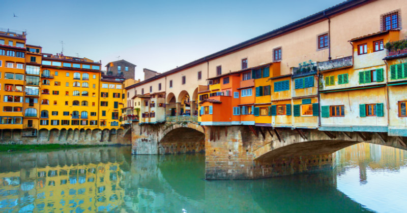 Colourful buildings against the turquoise river
